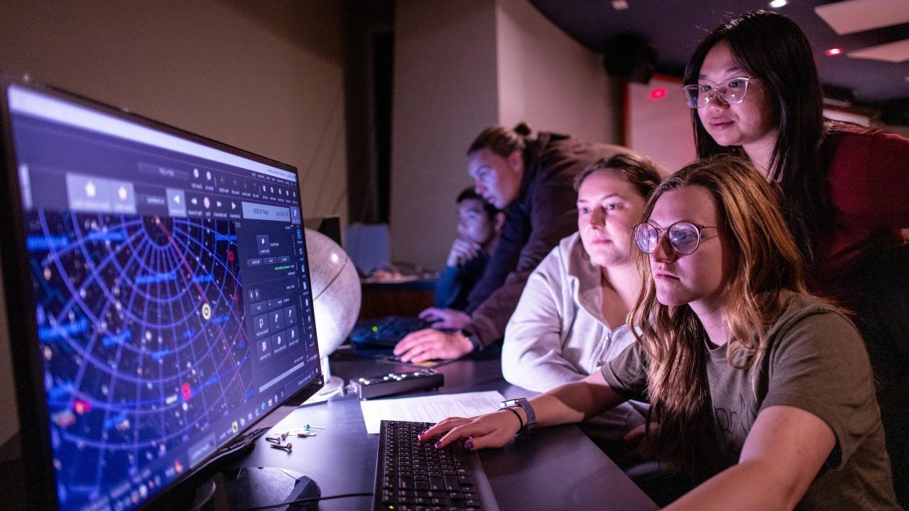 Astrophysics Minor students looking at data on computer